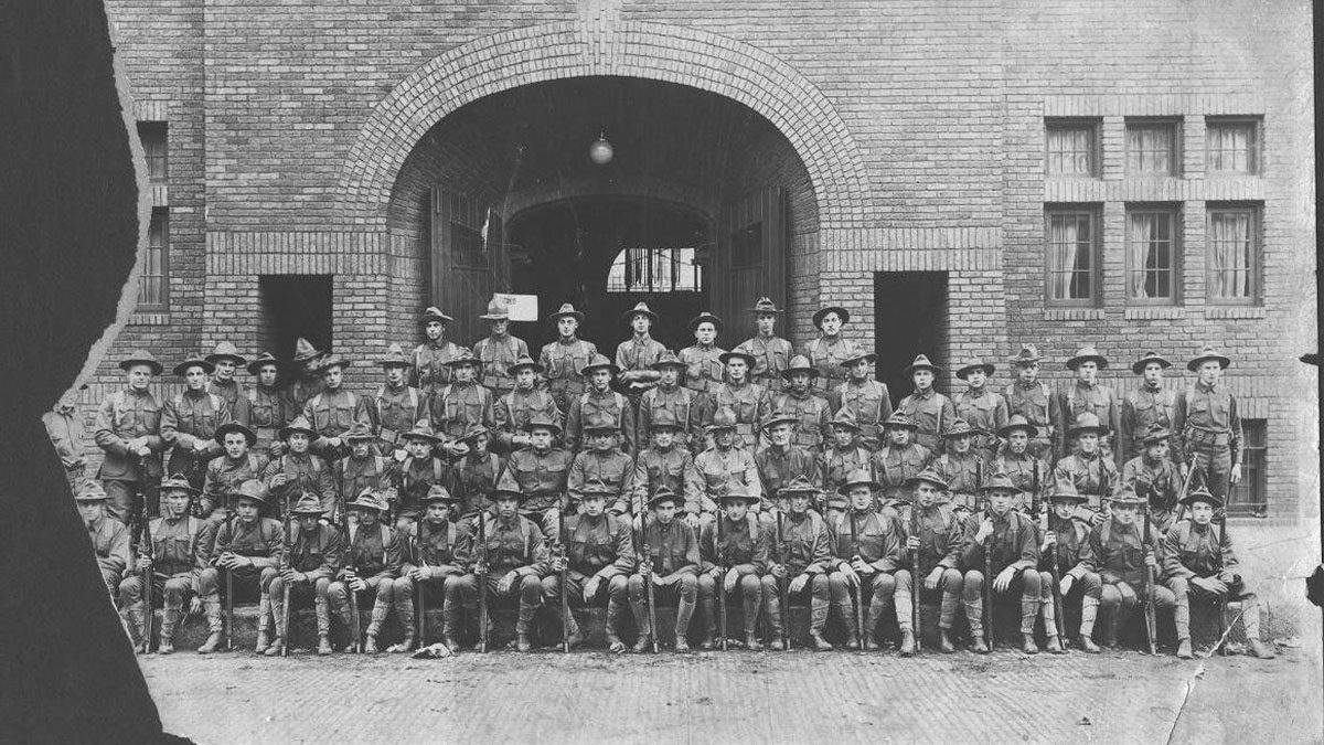 Troops in front of the National Guard Armory, now the Winona County Historical Society