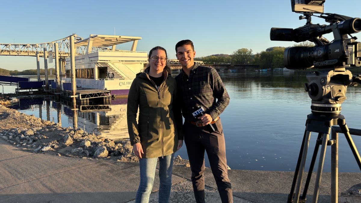 Jennifer Weaver of Winona County Historical Society with a KTTC news reporter at Levee Park.